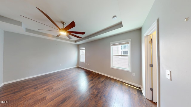421 Old Ride Dr, Holly Springs, NC 27540 - empty room with a raised ceiling, a ceiling fan, baseboards, dark wood finished floors, and a smoke detector