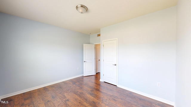 421 Old Ride Dr, Holly Springs, NC 27540 - spare room with dark wood-type flooring and baseboards
