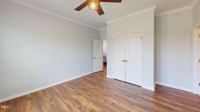 421 Old Ride Dr, Holly Springs, NC 27540 - unfurnished bedroom with wood finished floors, baseboards, ornamental molding, a closet, and ceiling fan