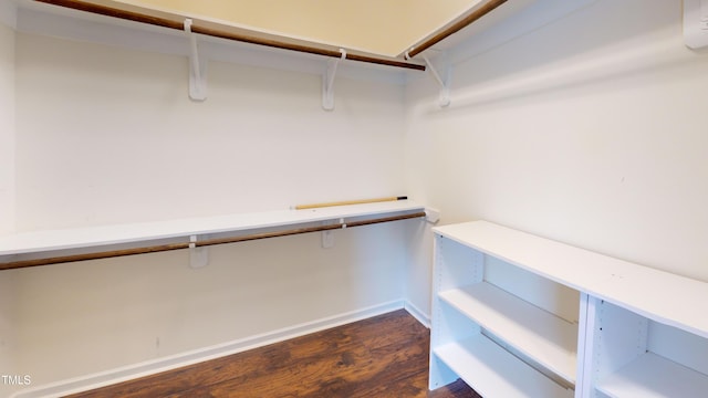 421 Old Ride Dr, Holly Springs, NC 27540 - spacious closet featuring dark wood finished floors