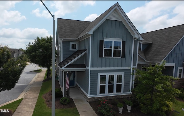 421 Old Ride Dr, Holly Springs, NC 27540 - view of front of house with board and batten siding and roof with shingles