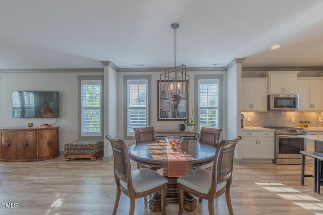 1624 Tunnel St, Wendell, NC 27591 - dining room featuring ornamental molding, healthy amount of natural light, light wood finished floors, and recessed lighting
