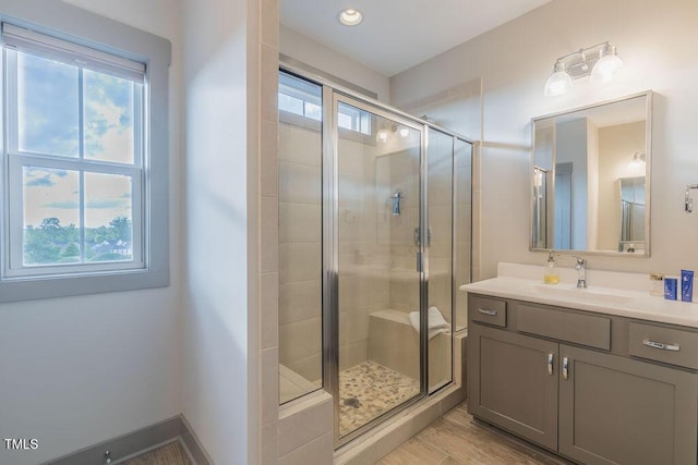 1624 Tunnel St, Wendell, NC 27591 - full bathroom with vanity, a shower stall, wood finished floors, and recessed lighting
