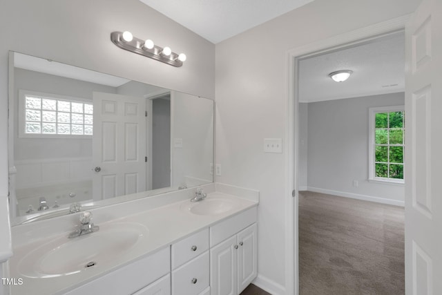 248 Robin Loop, Dunn, NC 28334 - full bathroom with double vanity, baseboards, and a bathtub