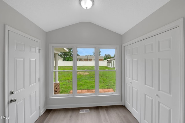 248 Robin Loop, Dunn, NC 28334 - entrance foyer with lofted ceiling, baseboards, and wood finished floors