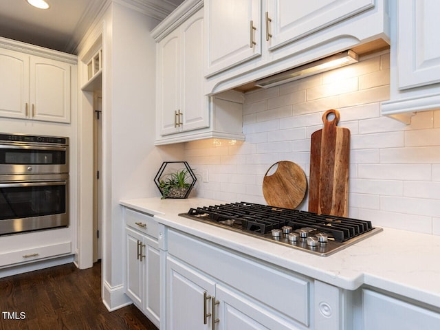 612 Peach Orchard Pl, Cary, NC 27519 - kitchen with appliances with stainless steel finishes, white cabinets, backsplash, dark wood-style floors, and recessed lighting