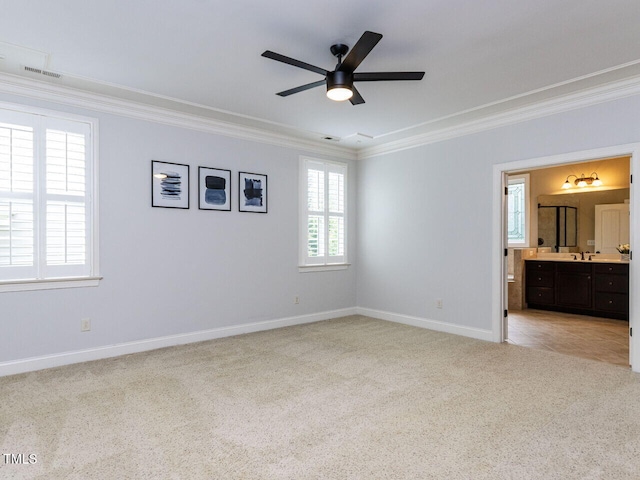 612 Peach Orchard Pl, Cary, NC 27519 - unfurnished bedroom featuring crown molding, light colored carpet, baseboards, ensuite bathroom, and a sink