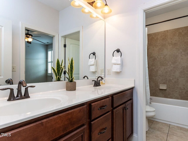 612 Peach Orchard Pl, Cary, NC 27519 - full bath featuring toilet, double vanity, tile patterned floors, shower / bath combination with curtain, and a ceiling fan