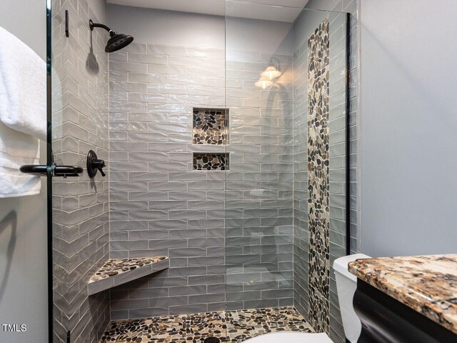 612 Peach Orchard Pl, Cary, NC 27519 - full bathroom featuring a shower stall, vanity, and toilet