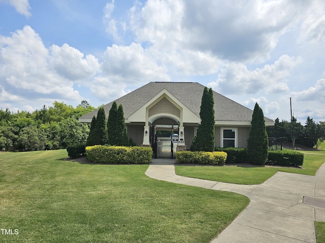 612 Peach Orchard Pl, Cary, NC 27519 - view of front of home with a front lawn, a shingled roof, and a gate