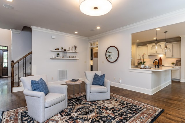612 Peach Orchard Pl, Cary, NC 27519 - living area with dark wood-style flooring, crown molding, stairway, baseboards, and recessed lighting