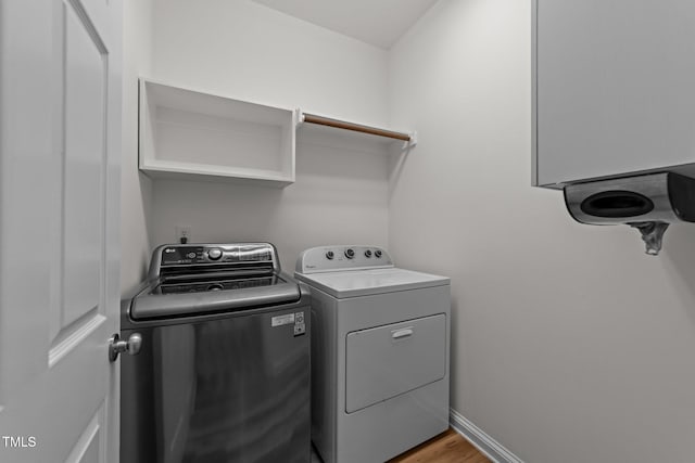 2913 Coxindale Dr, Raleigh, NC 27615 - laundry area featuring separate washer and dryer and light wood-style flooring