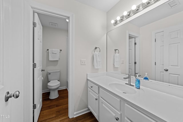 2913 Coxindale Dr, Raleigh, NC 27615 - bathroom featuring vanity and wood finished floors