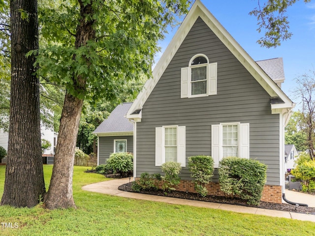 2913 Coxindale Dr, Raleigh, NC 27615 - view of front facade with a front yard and a shingled roof