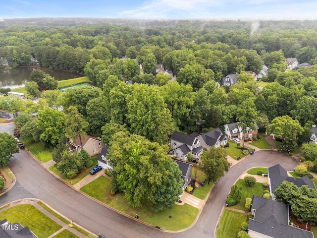 2913 Coxindale Dr, Raleigh, NC 27615 - aerial perspective of suburban area with a heavily wooded area and a large body of water