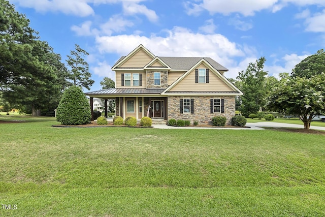 513 Goal Kick, Fuquay Varina, NC 27526 - craftsman-style home featuring stone siding, a porch, a front yard, and a metal roof