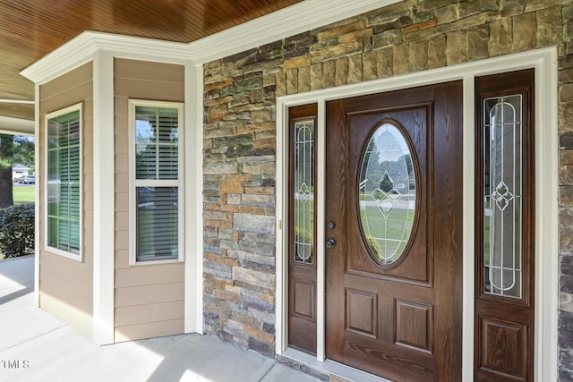 513 Goal Kick, Fuquay Varina, NC 27526 - doorway to property featuring stone siding and covered porch