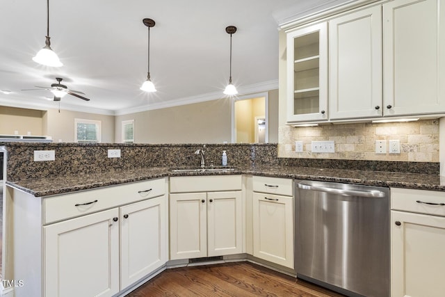 513 Goal Kick, Fuquay Varina, NC 27526 - kitchen featuring dishwasher, ornamental molding, hanging light fixtures, tasteful backsplash, and glass insert cabinets