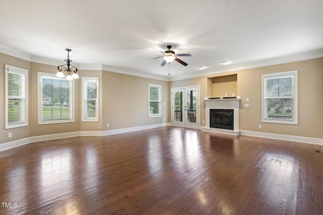 513 Goal Kick, Fuquay Varina, NC 27526 - unfurnished living room with plenty of natural light, wood finished floors, a chandelier, and crown molding