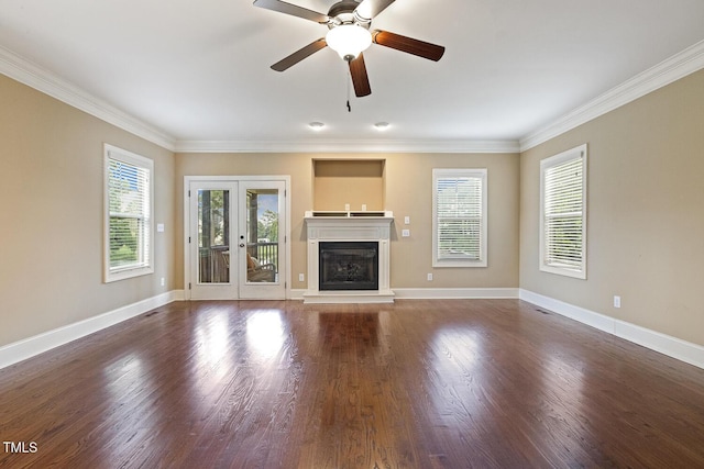 513 Goal Kick, Fuquay Varina, NC 27526 - unfurnished living room with crown molding, ceiling fan, wood finished floors, french doors, and a glass covered fireplace