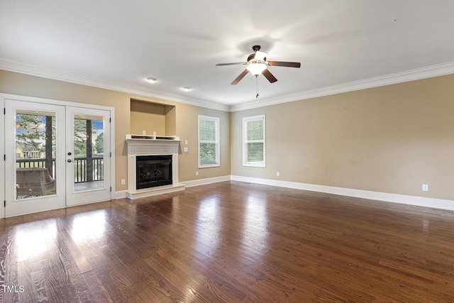 513 Goal Kick, Fuquay Varina, NC 27526 - unfurnished living room with a ceiling fan, wood finished floors, crown molding, french doors, and a glass covered fireplace