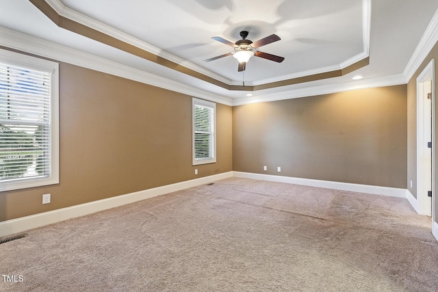 513 Goal Kick, Fuquay Varina, NC 27526 - carpeted spare room featuring a raised ceiling, crown molding, and a ceiling fan