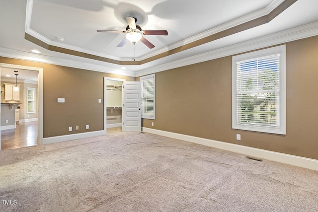 513 Goal Kick, Fuquay Varina, NC 27526 - unfurnished bedroom with a raised ceiling, crown molding, light colored carpet, a spacious closet, and recessed lighting