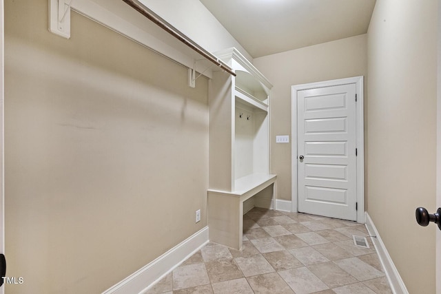 513 Goal Kick, Fuquay Varina, NC 27526 - mudroom featuring baseboards and stone finish floors