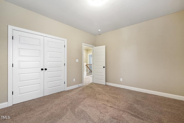 513 Goal Kick, Fuquay Varina, NC 27526 - unfurnished bedroom featuring carpet flooring and a closet