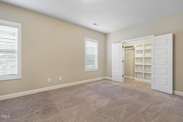 513 Goal Kick, Fuquay Varina, NC 27526 - unfurnished bedroom featuring carpet and a spacious closet