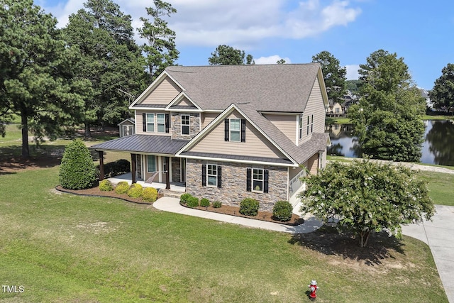 513 Goal Kick, Fuquay Varina, NC 27526 - craftsman-style home with stone siding, covered porch, a shingled roof, a standing seam roof, and a front lawn