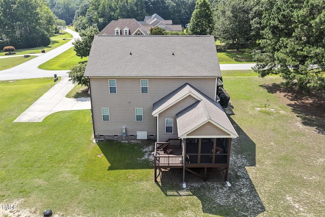 513 Goal Kick, Fuquay Varina, NC 27526 - rear view of property featuring a sunroom, a lawn, a shingled roof, and a wooden deck