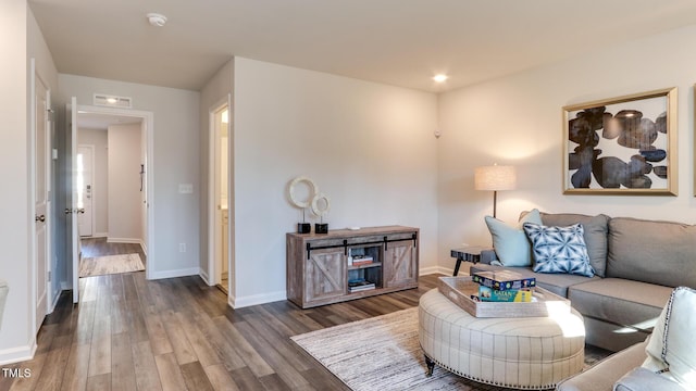 219 Carova Bnd, Apex, NC 27539 - living area featuring wood finished floors and baseboards