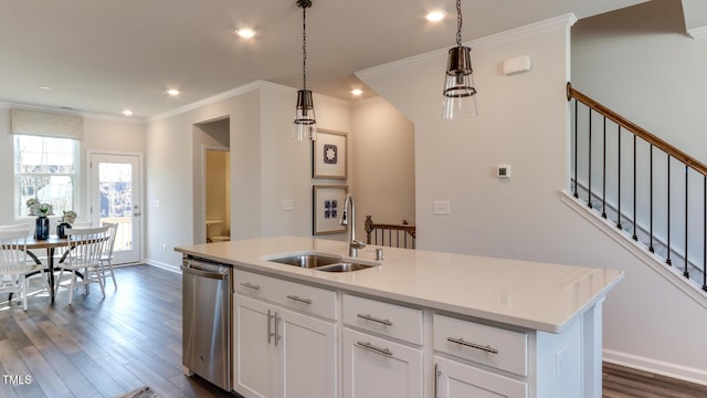 219 Carova Bnd, Apex, NC 27539 - kitchen featuring stainless steel dishwasher, a sink, dark wood-style floors, crown molding, and light countertops