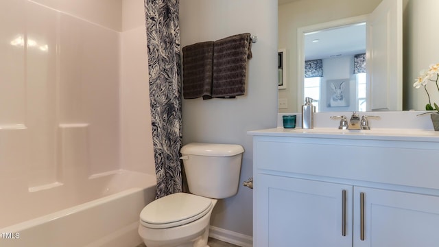 219 Carova Bnd, Apex, NC 27539 - full bathroom with toilet, vanity, shower / bath combo with shower curtain, and baseboards