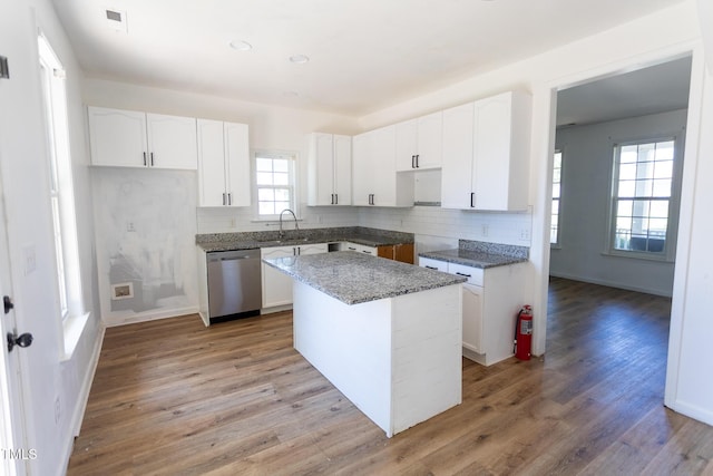 328 Mccarthy Dr, Clayton, NC 27527 - kitchen with dishwasher, decorative backsplash, white cabinetry, and light wood-style flooring