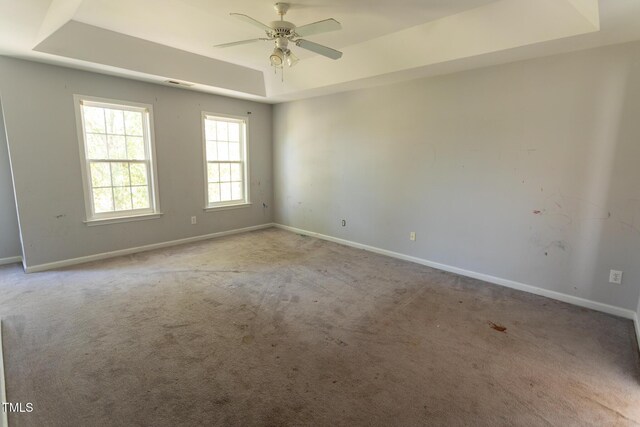 328 Mccarthy Dr, Clayton, NC 27527 - carpeted spare room with a tray ceiling, baseboards, and ceiling fan