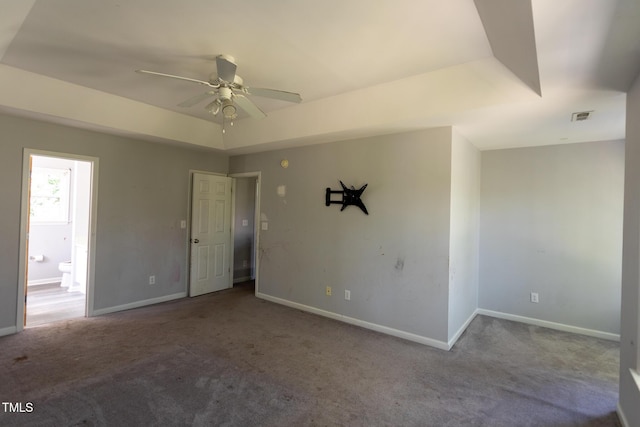 328 Mccarthy Dr, Clayton, NC 27527 - empty room with carpet flooring, a ceiling fan, baseboards, and a raised ceiling
