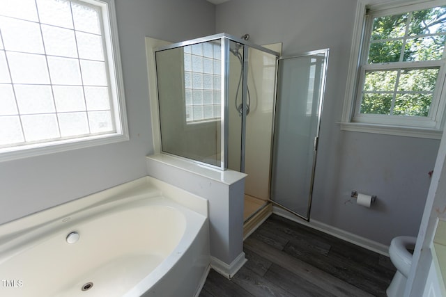 328 Mccarthy Dr, Clayton, NC 27527 - bathroom with a stall shower, a bath, wood finished floors, and toilet