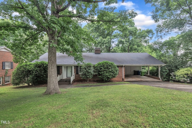 3304 Redbud Ln, Raleigh, NC 27607 - view of front of house featuring asphalt driveway, a chimney, a front yard, a carport, and brick siding