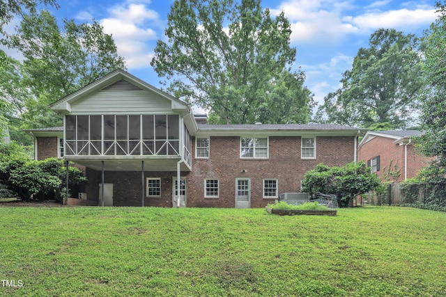 3304 Redbud Ln, Raleigh, NC 27607 - back of property featuring a sunroom, brick siding, and cooling unit