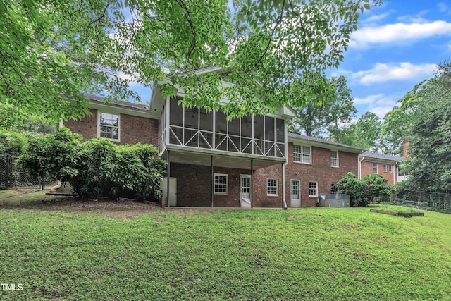 3304 Redbud Ln, Raleigh, NC 27607 - back of property featuring a sunroom and brick siding