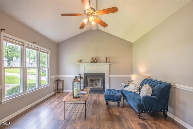 1309 Sweet Charm Ln, Knightdale, NC 27545 - living room with wood finished floors, ceiling fan, a glass covered fireplace, and lofted ceiling
