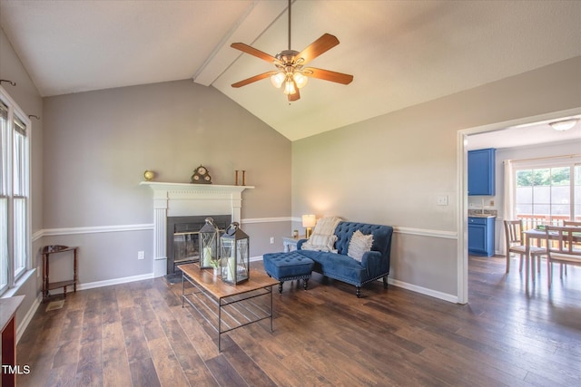 1309 Sweet Charm Ln, Knightdale, NC 27545 - living room featuring a ceiling fan, dark wood-style flooring, and a glass covered fireplace