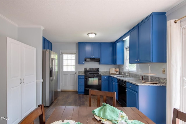 1309 Sweet Charm Ln, Knightdale, NC 27545 - kitchen featuring black appliances, blue cabinets, under cabinet range hood, dark wood-style floors, and crown molding