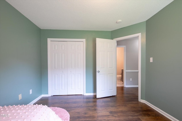 1309 Sweet Charm Ln, Knightdale, NC 27545 - bedroom with dark wood-type flooring and a closet