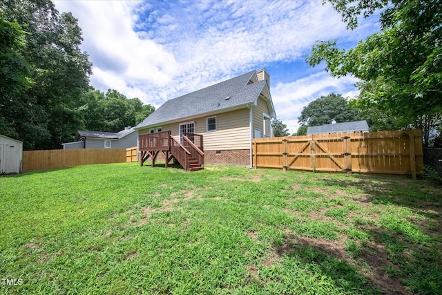 1309 Sweet Charm Ln, Knightdale, NC 27545 - back of property featuring a fenced backyard, a wooden deck, a gate, and crawl space
