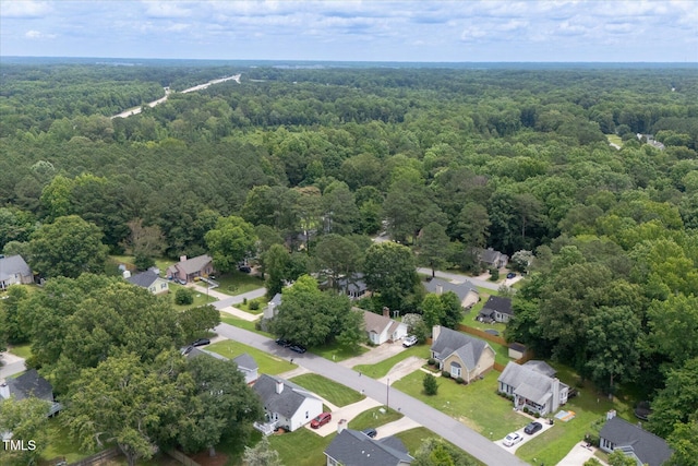 1309 Sweet Charm Ln, Knightdale, NC 27545 - aerial perspective of suburban area with a heavily wooded area