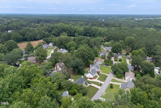 1309 Sweet Charm Ln, Knightdale, NC 27545 - aerial view of property and surrounding area featuring a forest and nearby suburban area