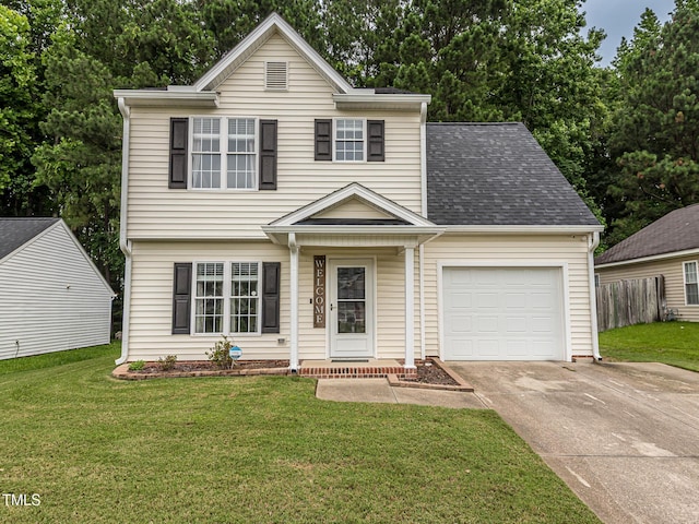 4020 Mindspring Dr, Raleigh, NC 27610 - view of front of home featuring an attached garage, driveway, and roof with shingles